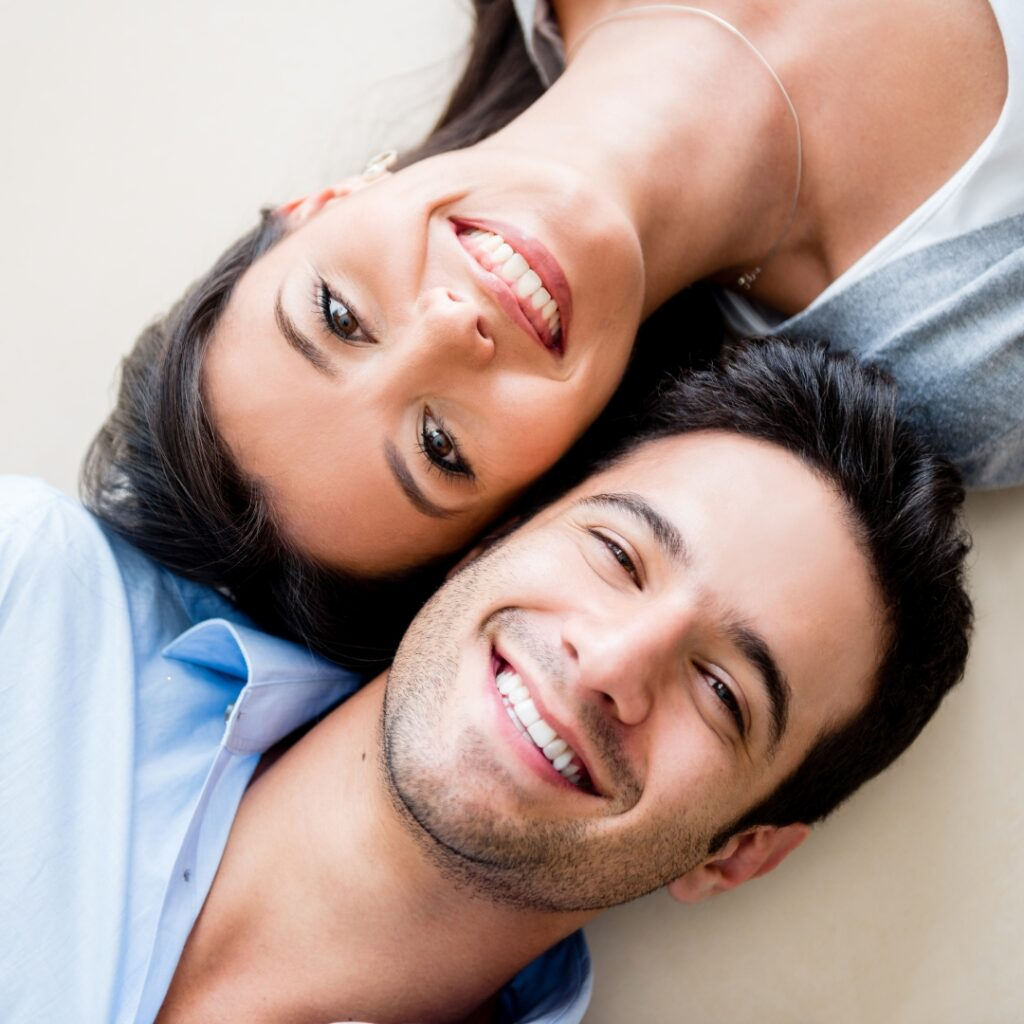 Happy couple smiling with confidence